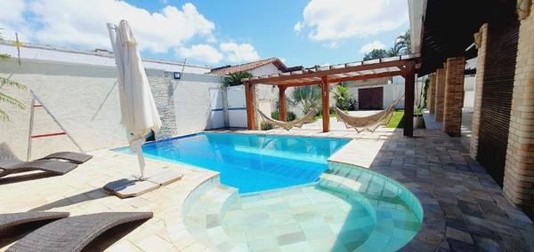 Casa do Sonho Piscina climatizada 6 suítes Varanda Gourmet Bilhar Pebolim