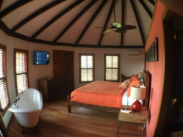 Exotic High End Unique Off-The-Grid Treehouse steps away from the Mopan River!