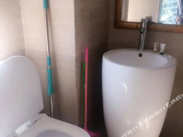 Xinjia Business Apartment Hotel