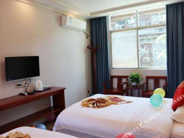 Towo Holiday Hotel (Manchuanguan Ancient Town Shop in Shanyang)