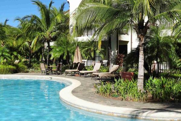 Ground-floor unit in front of lazy river pool at Pacifico in Coco