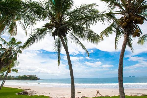 Warm interiors and orange hues on ground floor in front of beach in Flamingo