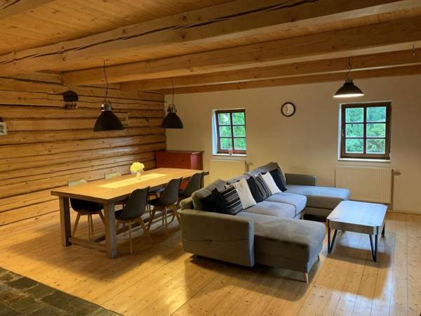 Detached log house with large fenced garden covered terrace