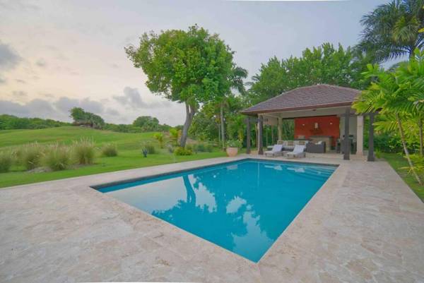 Golf and beach resort villa with beautiful sunsets pool golf cart and service staff
