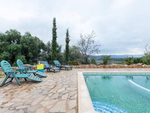 A beautifully restored farmhouse with a private pool in the mountains