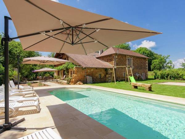Spacious farmhouse with private heated pool in a rustic garden.