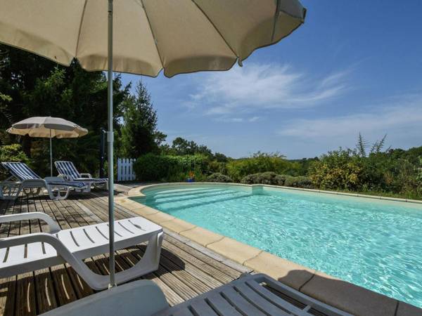 Holiday home in the woods with private swimming pool and lovely terrace.