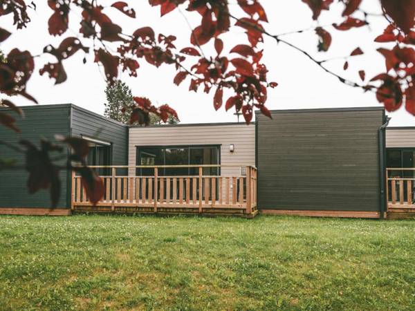 Modernly furnished cottage with beautiful terrace by a lake