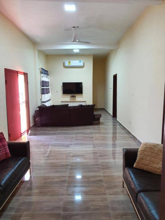 SUPERIOR APARTMENT 2 MASTER ENSUITE BEDROOMS WIFI LARGE LIVING ROOM 3 BATHS 3 TOILETS HOT WATER AIR CONDITION 24 hr SECURITY BIG KITCHEN DETACHED BUILDING 20 MINUTES KOTOKA AIRPORT ACCRA RESTAURANT BAR GARDEN LARGE CHILDREN PLAY AREA