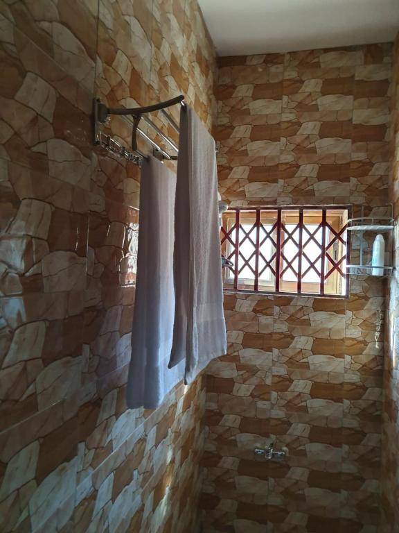 EXECUTIVE APARTMENT 2 master ensuite bedrooms 3 toilets 3 baths hot water air conditioned separate fitted kitchen separate living room large compound 24hr security electric fenced wall restaurant bar WIFI about 20 minutes from the airport