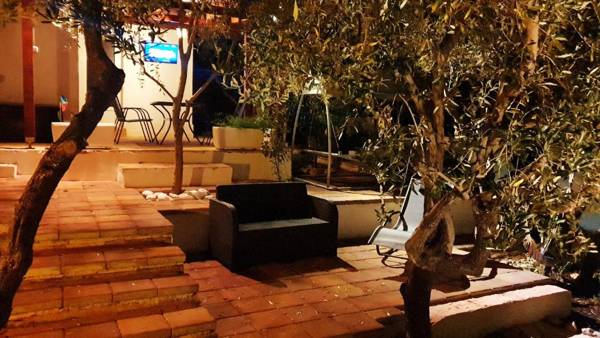 House with big walled oliva garden