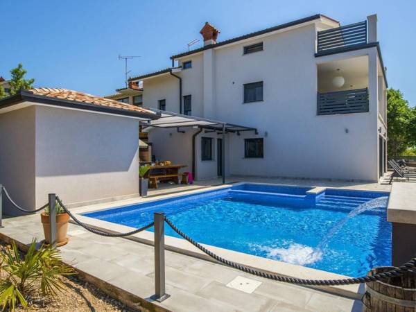 Villa with swimming pool outdoor kitchen sauna jacuzzi play area and sea view