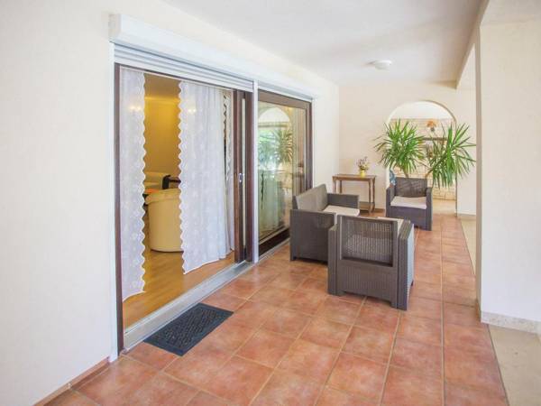 Nicely furnished apartment with covered terrace located in front of the pool