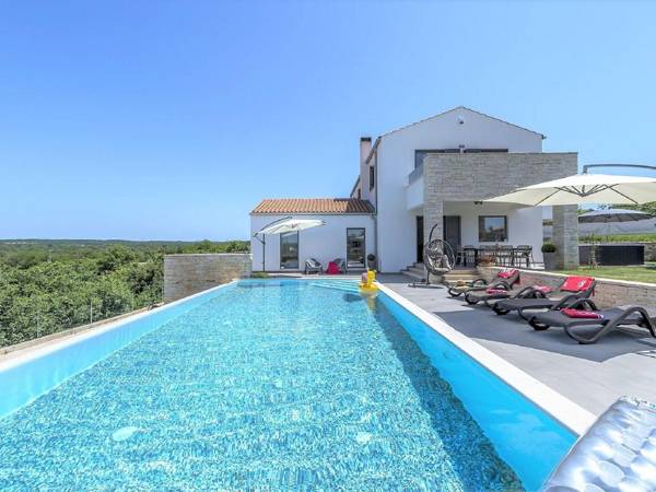 Luxury villa with infinity swimming pool outdoor jacuzzi and garden