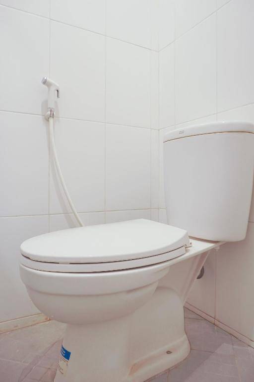 Vaccinated Staff - OYO 408 Graha Vege Jawi Syariah