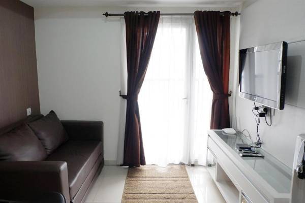 Homey 1BR @ The Wave near Epicentrum By Travelio