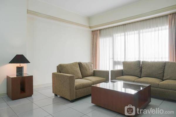 Comfortable 2BR Palm Court Apartment By Travelio