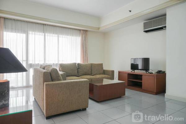 Comfortable 2BR Palm Court Apartment By Travelio