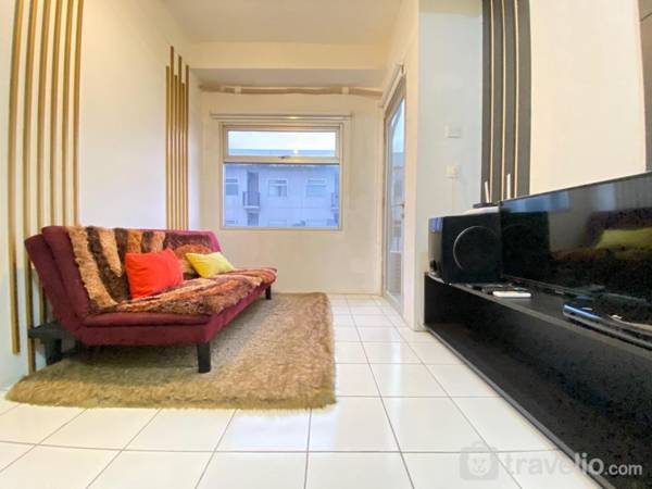 Bright 1BR Grand Asia Afrika Residence By Travelio