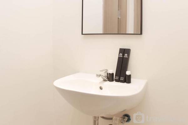 Warm and Cozy Living 3BR at Meikarta By Travelio