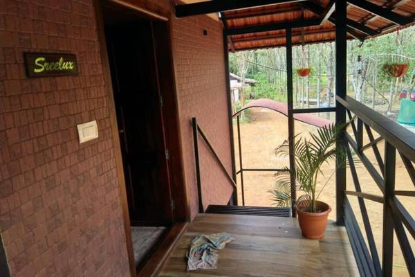 Sansree's Puzhakkal Riverview Cottage