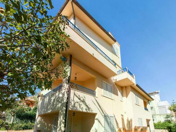 A sun-drenched holiday apartment just a few metres from the Sicilian coastline