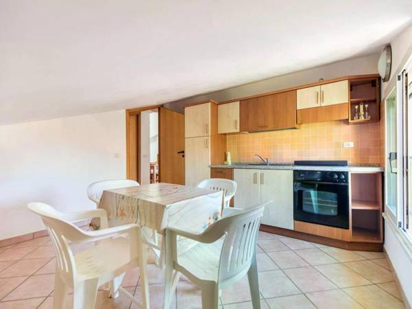 A sun-drenched holiday apartment just a few metres from the Sicilian coastline