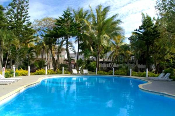 One bedroom appartement at Grand Baie 800 m away from the beach with shared pool enclosed garden and wifi