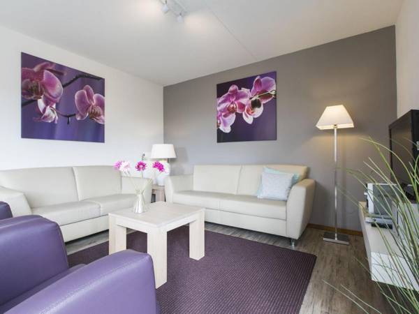 Luxurious villa with microwave within green surroundings