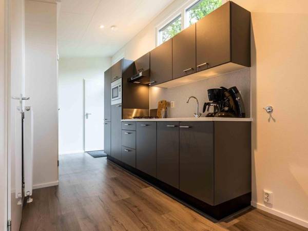 Cosy chalet with combi-microwave in a water-rich area