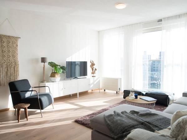 Modern apartment balcony overlooking exclusive seaworthy yachts