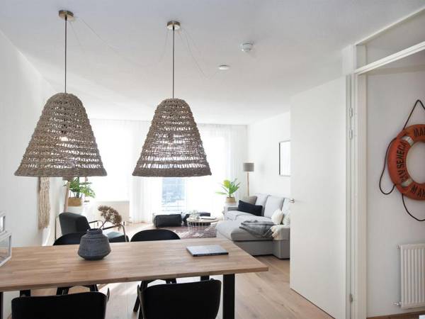 Modern apartment balcony overlooking exclusive seaworthy yachts