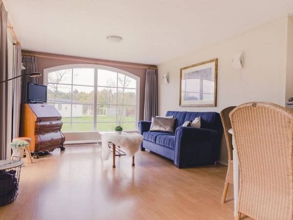 Comfy chalet with a dishwasher directly on a pond