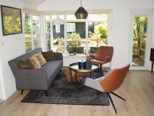 Atmospheric house on the water surrounded by nature