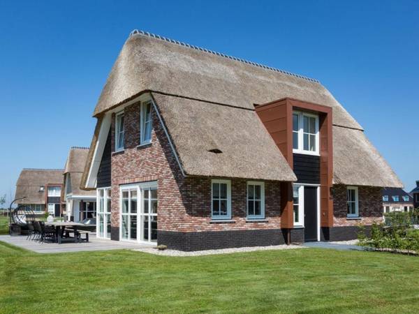 Beautiful thatched villa with a terrace at the Tjeukemeer