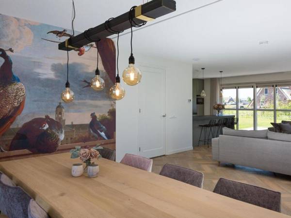 Beautiful thatched villa with a terrace at the Tjeukemeer