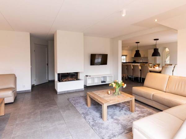 Beautiful house with a fireplace surrounded by nature