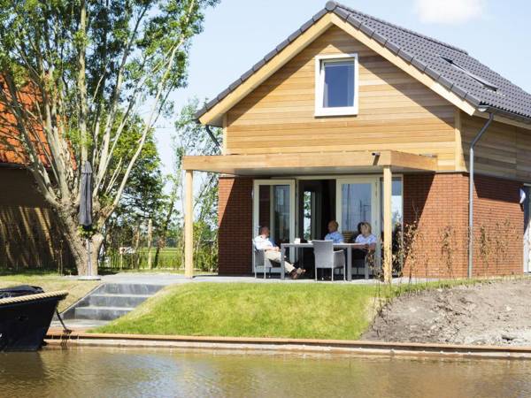 Stylish modern holiday home with a terrace by the water