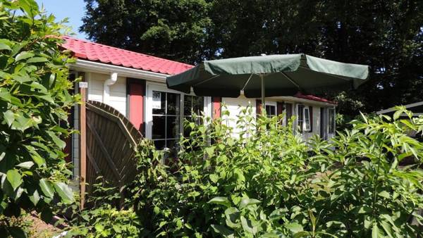 Beautiful detached wooden house with a pretty garden in the Veluwe