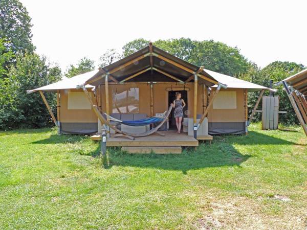 Striking tent lodge with a porch located near the Veluwe