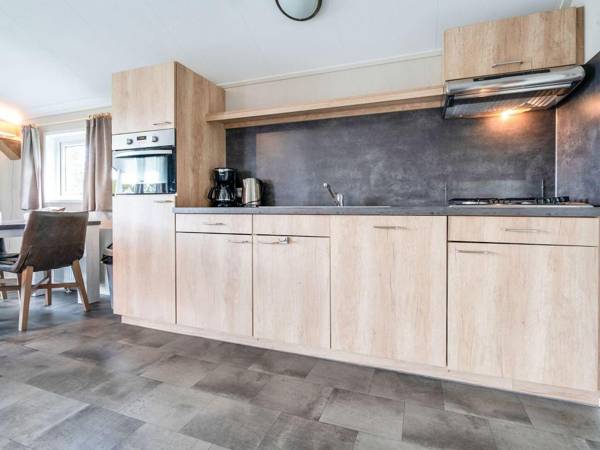 Beautiful home with a veranda and jetty located near a pond