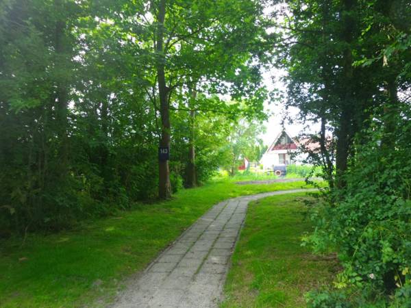 Sonnenhaus 6 pers house with sunny terrace at a typical dutch canal & by Lauwersmeer lake.