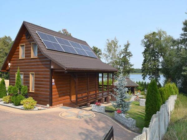 A luxury home on the shore of the lake. Living room with fireplace 2 bedrooms.