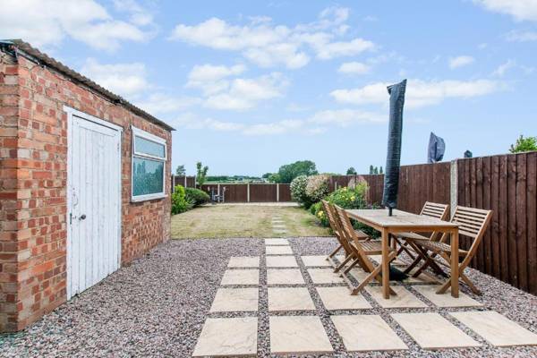 Modern Home with Garden and Farmland Views