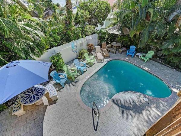 Ideal beach hideaway pool condo located between the island marina and beach